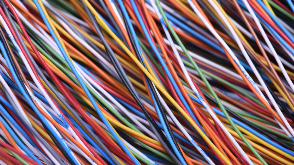 A picture of electrical wires that is the end result of wire harness manufacturing