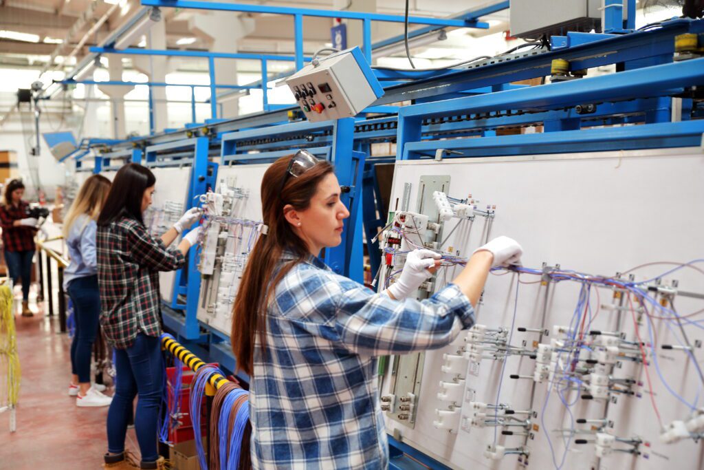 Formboard Harness and Technician Scaled. Wire harness diagrams transformed in electrical wires on a formboard
