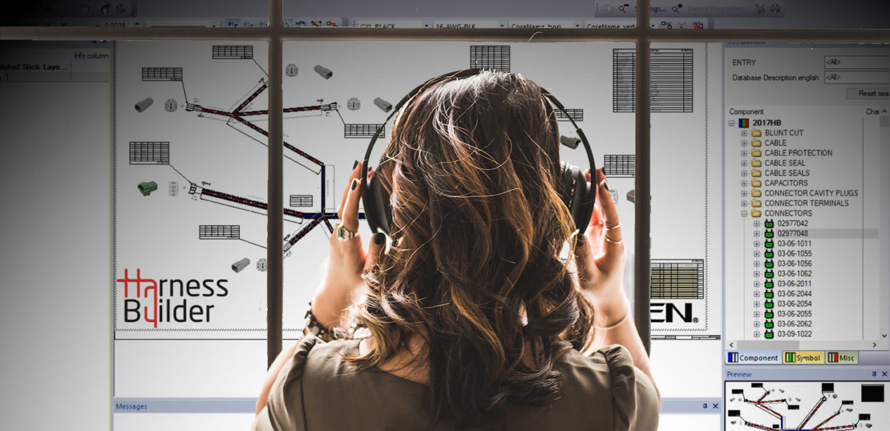 Person using the E3.series software for harness design with the database editor on screen, indicative of the process of modifying multiple library parts in electrical design