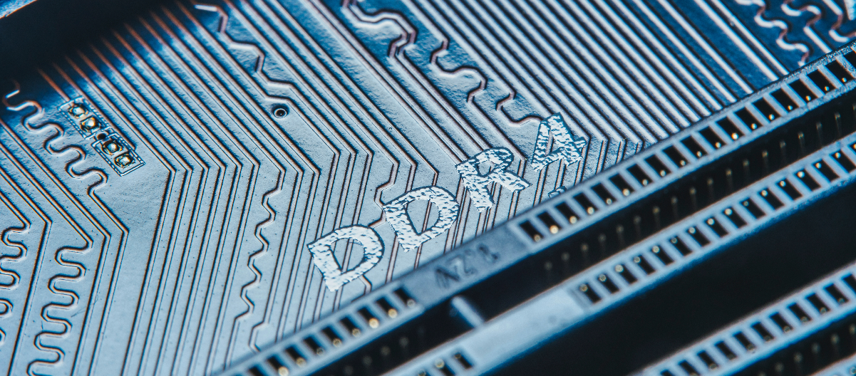 Detailed view of a DDR4 memory module, highlighting intricate circuit patterns and metallic connectors indicative of high-speed data processing capabilities.